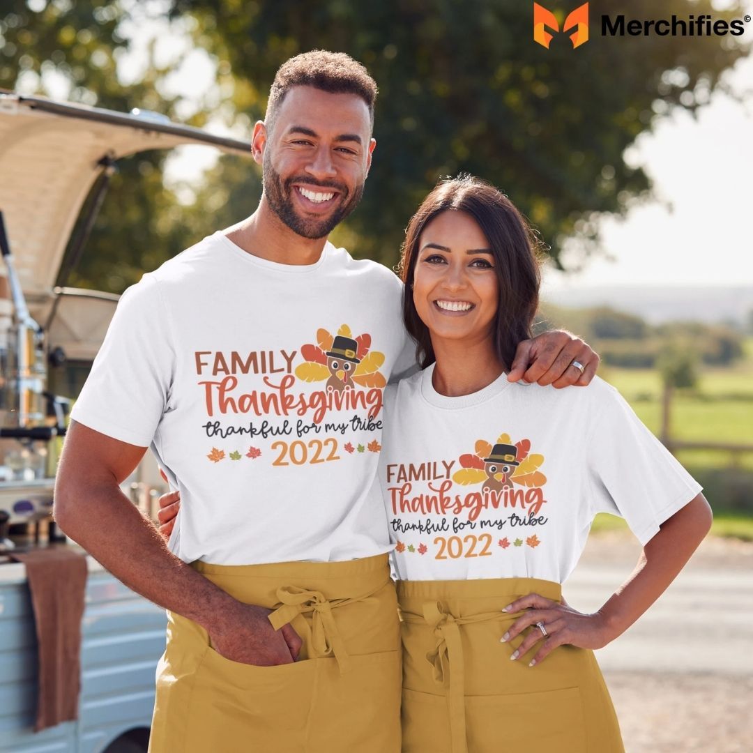 Real families showing off their matching Thanksgiving shirts with pride and joy.