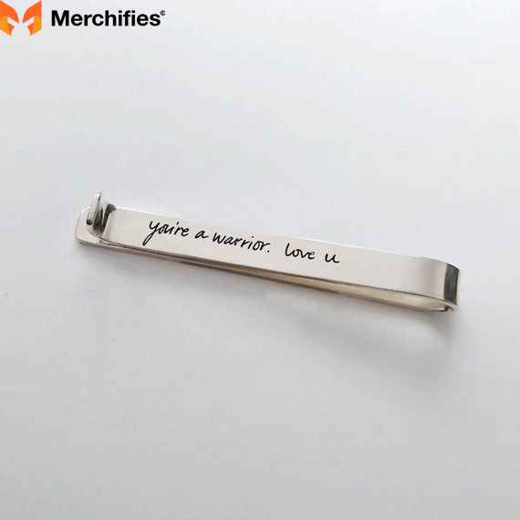 Gold tie bar with a hidden sweet message
